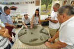  Hajdó Ernő, director of the Association of Hungarian Blind People in Romania, explores the clay model in the workshop of the sculptor Berze Imre